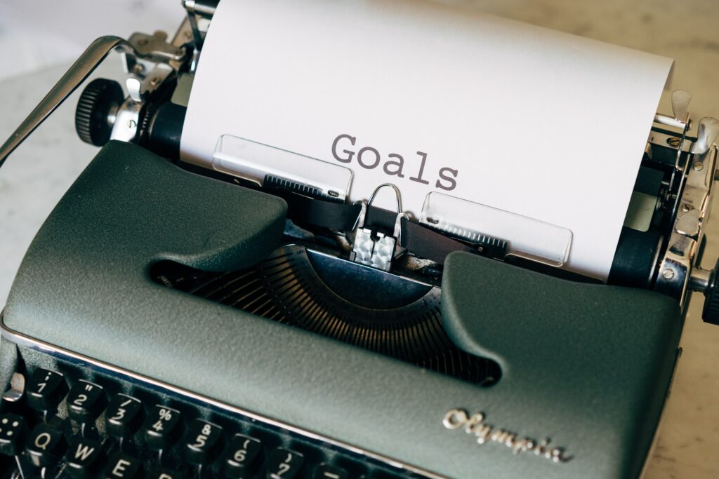 Typewriter with "Goals" typed on a piece of paper.